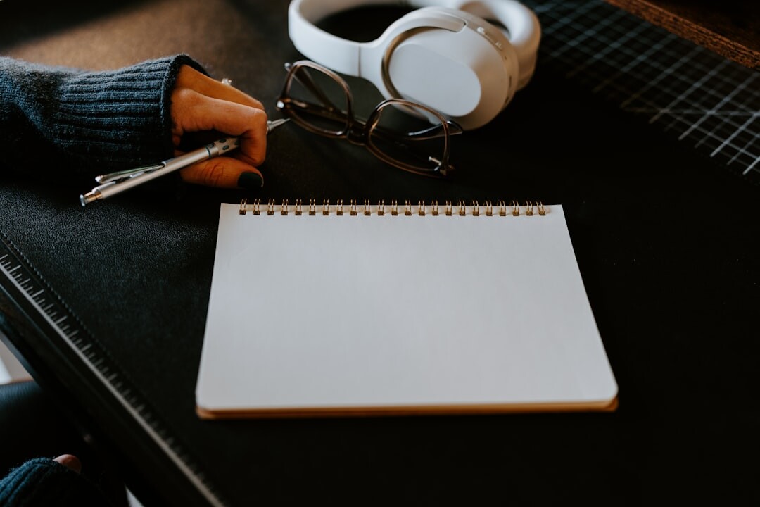writer at desk with notebook